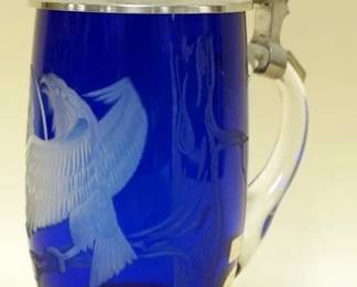 1057	BAVARIAN CRYSTAL COLBALT BLUE ETCHED GLASS STEIN JEWELED PEWTER LID, APPROXIMATELY 9 IN H. SIGNED & NUMBERED
