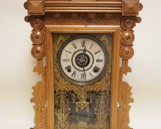 1148	VICTORIAN WALNUT SHELF CLOCK W/ALARM, APPROXIMATELY 5 IN X 16 IN X 25 IN HIGH
