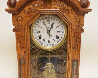 1149	WATERBURY PRESSED OAK SHELF CLOCK W/HYDROMETER & THERMOMETER, APPROXIMATELY 4 1/2 IN X 15 IN X 23 IN HIGH
