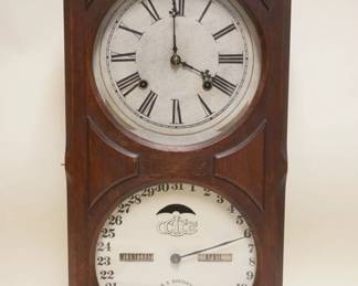 1150	ITHICA CALENDAR CLOCK IN WALNUT CASE, CLOCK FACE & BACK REPLACED, APPROXIMATELY 5 IN X 12 IN X 25 IN
