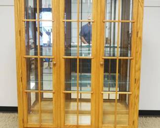1163	THOMASVILLE SOLID OAK TRIPLE BEVELED GLASS DOOR, MIRROR BACK CRYSTAL CABINET W/ADJUSTABLE GLASS SHELVES & INTERIOR LIGHTS, 3 DRAWERS AT BASE, APPROXIMATELY 55 IN X 19 IN X 80 IN HIGH

