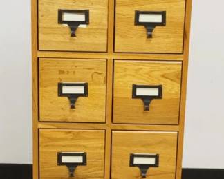 1169	OAK 12 DRAWER CABINET, APPROXIMATELY 15 IN X 7 IN X 40 IN HIGH
