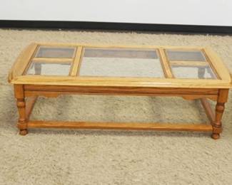 1175	SOLID OAK BASSETT 3 PIECE COFFEE & LAMP TABLE SET W/INSET BEVELLED GLASS TOPS, END TABLES APPROXIMATELY 28 IN X 22 IN X 21 IN, COFFEE TABLE APPROXIMATELY 53 IN X 24 IN X 16 IN HIGH
