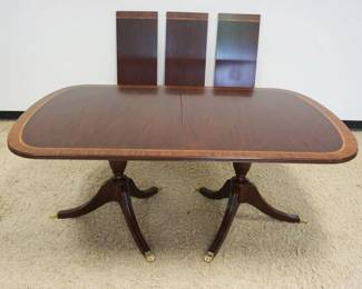 1193	HENKEL HARRIS MAHOGANY BANDED DINING ROOM TABLE, APPROXIMATELY 46 IN X 72 IN X 30 IN HIGH W/3 LEAVES APPROXIMATELY 16 IN EACH
