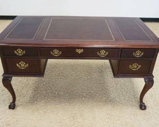 1211	MAHOGANY BALL & CLAW FOOT CHIPPENDALE STYLE DESK, 5 DRAWER W/INSET LEATHER TOP, APPROXIMATELY 56 IN X 28 IN X 31 IN HIGH
