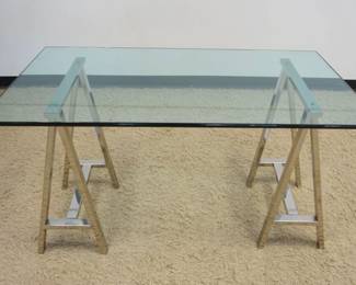 1245	RESTORATION HARDWARE MODERN GLASS TOP TABLE W/TWIN CHROME SAW HORSE BASE, APPROXIMATELY 60 IN X 36 IN X 31 IN HIGH
