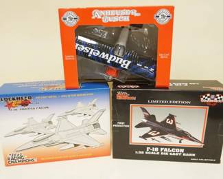 1324	LOT OF 3 BOXED AIRPLANE BANKS LOCKHEED, F-16 FALCON, BUDWEISER
