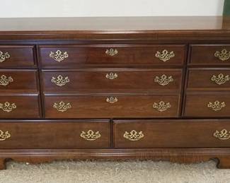 1196A	CHEST OF DRAWERS WITH CHERRY FINISH, HAVING 8 DRAWERS, APPROXIMATELY 63 IN X 18 IN X 32 IN
