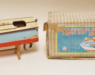 1297A	TOY MOTORIZED BOAT IN ORIGINAL BOX, SOME PAINT LOSS
