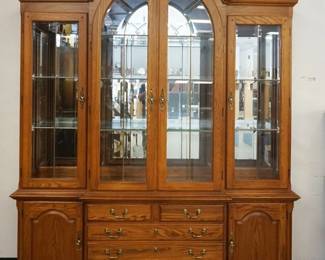 1179	THOMASVILLE SOLID OAK LEADED GLASS, DOME TOP BREAKFRONT W/MIRROR BACK, INTERIOR LIGHTS & ADJUSTABLE GLASS SHELVES
