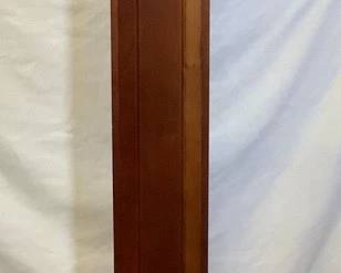 DONLAR205 Sligh Pencil Clock Made by Sleigh in Holland, Michigan, solid hardwood pencil clock. Quartz movement with a 4/4 chime. Works very well and has a nice, soft, short chime. Takes 2 'C' batteries.