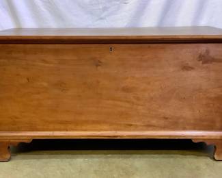JIFI200 1830s Cherry Blanket Chest A beautiful cherry wood blanket chest with a key. Inside the chest has a smaller compartment that can be used to store other items. Does have some wear to it and the key does lock the chest.
