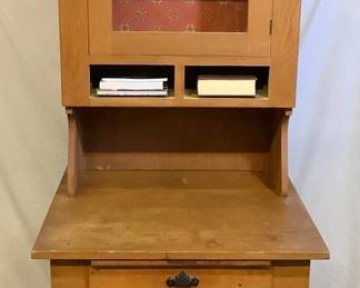 JIFI206 Antique Possum Belly Bakers Cupboard This comes in 2 separate pieces & has a large metal belly bottom drawer. Once used by bakers to contain flour. There are tow spaces for drawers, just below the glass cabinet door, but they could not be found at time of shooting lot. We will continue to look for them but cannot guarantee they will be located by time of auction pick up or at all. Cook books (not included) fit well & look nice, in the two spaces.