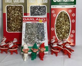 JIFI707 Vintage Christmas Tree Trimmings Lot includes: 4 Packages of Tinsel, 9 Santa's and 3 Puxies. Tinsel packages differ in quantity - see pics.