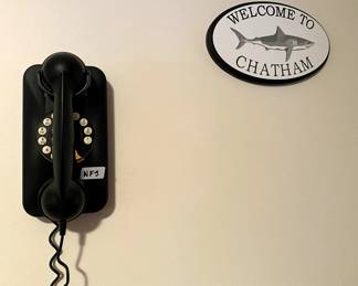 Phone not for sale...Used to help with scale/size of sign.  (Chatham Wind & Time)