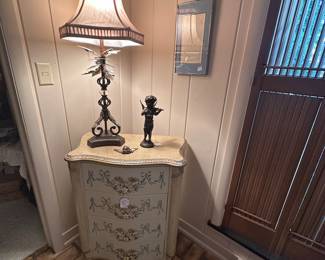 4 Drawer Serpentine Chest with Painted Flowers and Ribbons, Table Lamp, Angel Statue playing violin