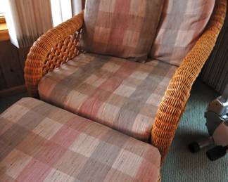Two wicker chairs with ottomans