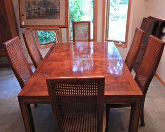 Burl and cane dining room table with two leaves