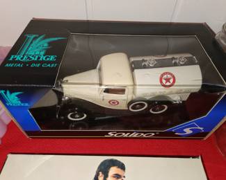 Metal Texaco Truck in Box.  That's Bert Reynolds Head there below. He is showing his naked butt for a Puzzle. 