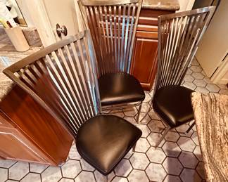 Four quality brushed stainless steel side chairs with black leather seats!