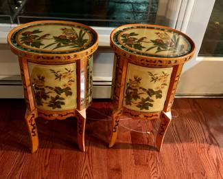 Matched pair of hand painted oval shape tables with glass tops