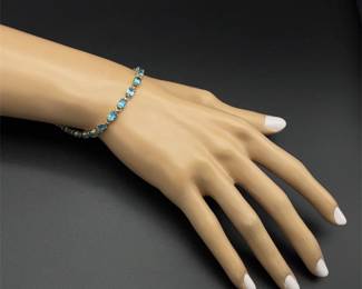 Oval Natural Blue Topaz Single Row Hinge Link Tennis Bracelet in Yellow Gold