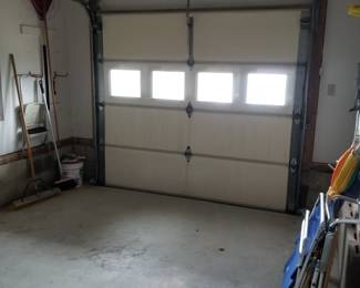 Insulated garage door with opener