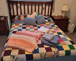 Full Size Bed and Several Handmade Baby Blankets and a Hand Crocheted Bed Spread.