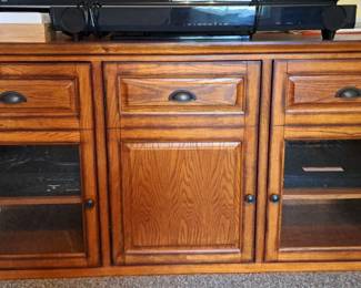 Beautiful 3 Door Television Stand and a Yamaha Surround Sound  System