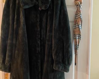 Sheared beaver coat and umbrella