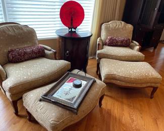 Walnut armchairs upholstered with ottomans; tall side table with black marble top by Liz Claybourne