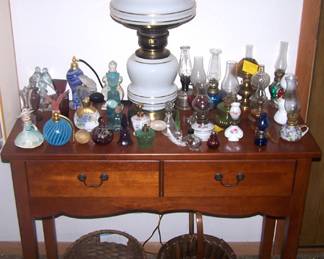 Small two drawer table, cologne/perfume bottle collection, miniature lamp collection