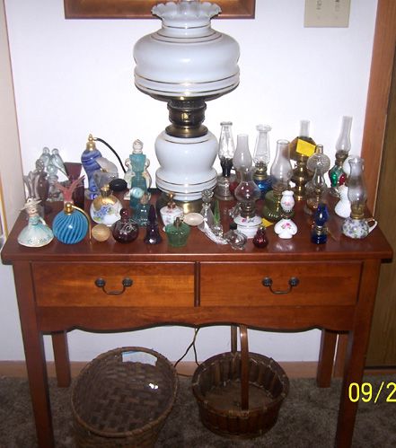 Small two drawer table, cologne/perfume bottle collection, miniature lamp collection