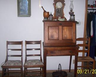 Small antique drop front desk, kitchen clock, assorted chairs