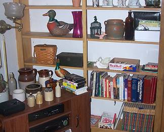 Corner entertainment center, crocks, Precious Moments, books