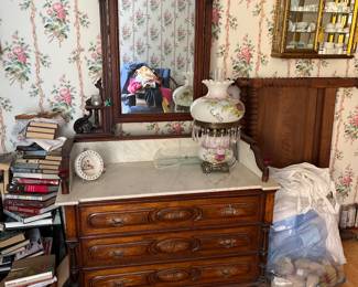 Marble topped dresser with ornate mirror