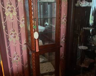 Curio cabinet tall/narrow fits in a narrow space  We have a corner one as well.....