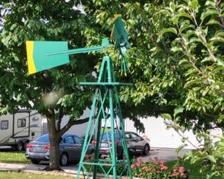 green and yellow outdoor decorative windmill