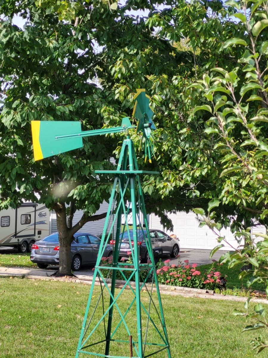 green and yellow outdoor decorative windmill