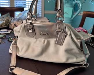 Cream and silver Coach purse, overall nice condition, has some mild small spots on back 6"H x 14"W