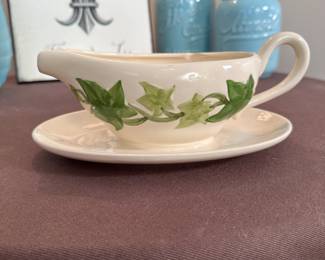 Hand-painted vine pattern gravy with connected saucer, mild chip on inside