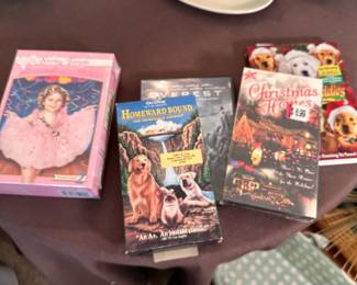 Group of DVDs and VHS including Shirley Temple and Homeward Bound