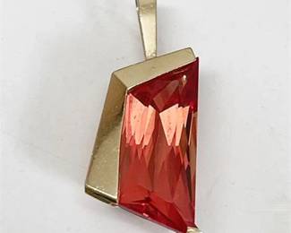 Lot 036  
Contemporary Orange Sapphire and 14 K Yellow Gold Pendant