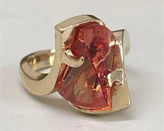 Lot 040   
Contemporary Orange Sapphire and 14 K Yellow Gold Ring