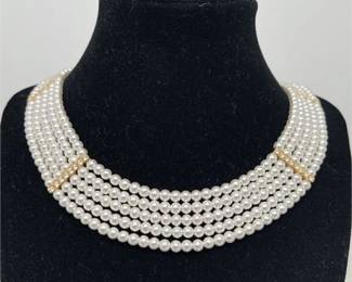 Lot 042  
Jacqueline Kennedy Classic Triple Strand Simulated Pearl Necklace