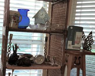 Wicker Etagere set holds brass candlesticks, water pitchers and decor