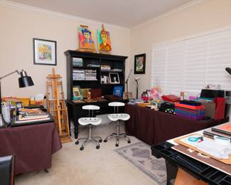 Desk and chairs and some items sold.