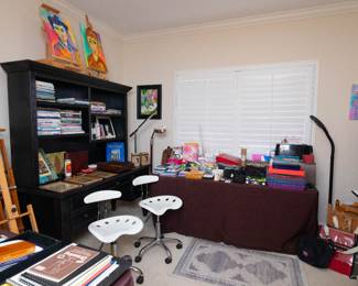 Desk and chairs and some items sold.