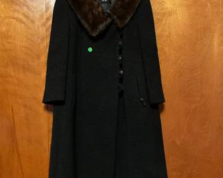 Old coat - fur is likely real.