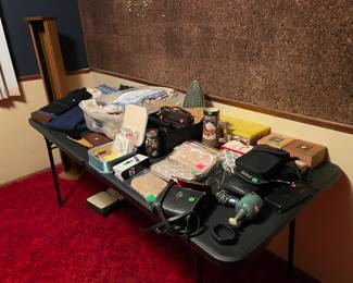 Vintage personal items including wool sweaters, old linens, purses, hankerchiefs.